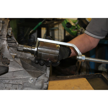 Action shot of drive shaft disassembly tool 